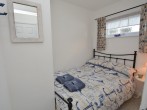 Compact double bedroom accessed on one side Compact double bedroom accessed on one side
