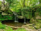 Waterfall with shallow pool within the grounds Waterfall with shallow pool within the grounds