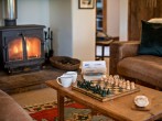 Enjoy relaxing afternoons playing games or reading by the fire Enjoy relaxing afternoons playing games or reading by the fire