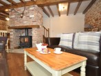 Enjoy relaxing by the woodburner in the lounge area Enjoy relaxing by the woodburner in the lounge area