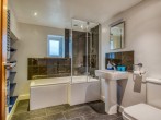 Take a leisurely shower or bubble bath in this spacious bathroom Take a leisurely shower or bubble bath in this spacious bathroom