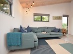 Stylish open-plan interiors with bi-folding doors to the decking Stylish open-plan interiors with bi-folding doors to the decking