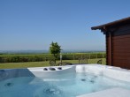 Relax and enjoy a dip in the lovely hot tub and admire the views Relax and enjoy a dip in the lovely hot tub and admire the views