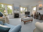 Relax in the bright and airy sitting room overlooking the pretty garden Relax in the bright and airy sitting room overlooking the pretty garden