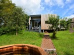A stunning eco friendly lodge set in a streamside orchard with hot tub A stunning eco friendly lodge set in a streamside orchard with hot tub