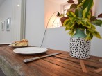 The dining table cleverly crafted from recliamed timbers The dining table cleverly crafted from recliamed timbers