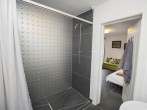 En-suite shower room with shower operated push button control En-suite shower room with shower operated push button control