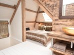 Stylish mezzanine bedroom set into the eaves Stylish mezzanine bedroom set into the eaves