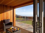 Admire the stunning bay views from the covered decking area Admire the stunning bay views from the covered decking area