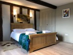 Get a good night's rest in this king-size bedroom with en-suite shower room Get a good night's rest in this king-size bedroom with en-suite shower room
