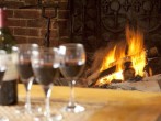 Enjoy a glass of wine in front of the open fire Enjoy a glass of wine in front of the open fire