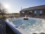 Sit in the hot tub and enjoy the fabulous views Sit in the hot tub and enjoy the fabulous views