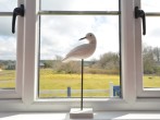 The master bedroom with views towards the dunes and a glimpse of the sea