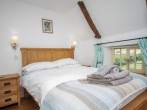 Cosy double bedroom with exposed beams Cosy double bedroom with exposed beams