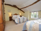 Spacious bedroom with a double bed and an additional single bed