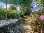 Perfect spot for al fresco meals and drinks in the enclosed garden