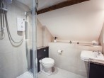 The bedroom has an en-suite shower and WC The bedroom has an en-suite shower and WC