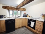 A well-equipped kitchen situated on the lower ground floor A well-equipped kitchen situated on the lower ground floor
