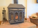 Curl up in front of the cosy wood burner in the lounge Curl up in front of the cosy wood burner in the lounge