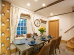 Bright dining area with comfy seating for six Bright dining area with comfy seating for six