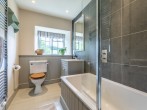 Bathroom with shower over bath and WC Bathroom with shower over bath and WC