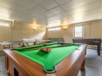 Games room with pool table, table tennis and table football Games room with pool table, table tennis and table football