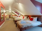 This room can sleep up to ten guests, great for large groups This room can sleep up to ten guests, great for large groups