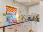 Enjoy preparing a home cooked meal in this well-equipped kitchen Enjoy preparing a home cooked meal in this well-equipped kitchen