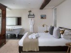 Pen-y-Fan king-size bedroom with free standing bath to enjoy the views Pen-y-Fan king-size bedroom with free standing bath to enjoy the views