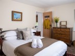 Pen-y-Crug bedroom with king-size bed and large en-suite bathroom Pen-y-Crug bedroom with king-size bed and large en-suite bathroom