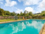 Enjoy using the shared outdoor pool and lawn tennis court Enjoy using the shared outdoor pool and lawn tennis court