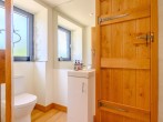 A 'Jack and Jill' shower room with a freestanding shower and WC A 'Jack and Jill' shower room with a freestanding shower and WC